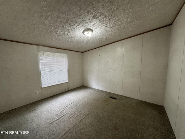 214 Hickory Grove Rd, Madisonville, TN 37354 - unfurnished room featuring carpet flooring, a textured ceiling, and a decorative wall