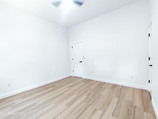 2714 E 5th Ave, Knoxville, TN 37914 - unfurnished room featuring light wood-style floors, a ceiling fan, and baseboards
