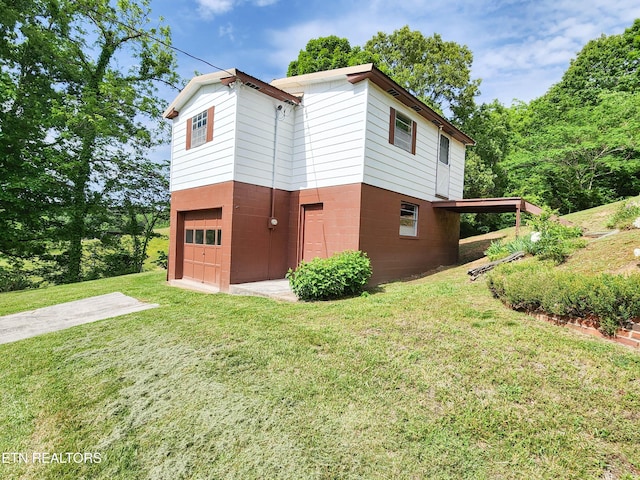 1711 Rocky Branch Rd, Rutledge, TN 37861 - view of home's exterior with a garage and a yard