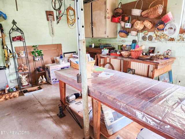 1711 Rocky Branch Rd, Rutledge, TN 37861 - dining space featuring unfinished concrete floors and concrete block wall
