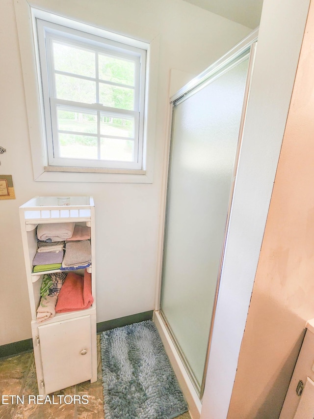 1711 Rocky Branch Rd, Rutledge, TN 37861 - bathroom with a stall shower and baseboards
