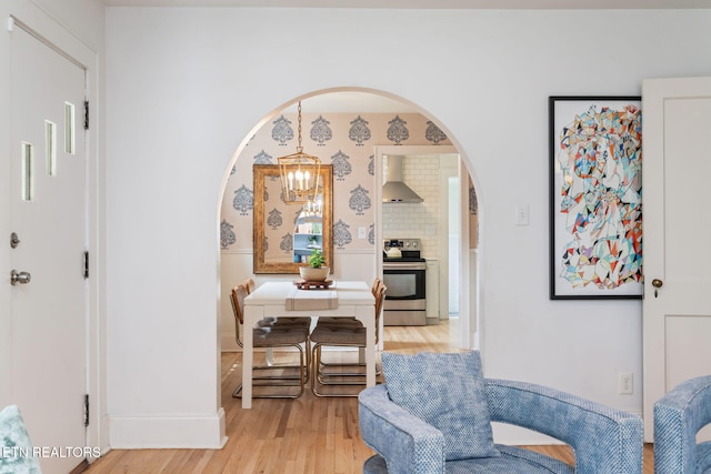 4051 Sutherland Ave, Knoxville, TN 37919 - living area with light wood-type flooring, arched walkways, and baseboards