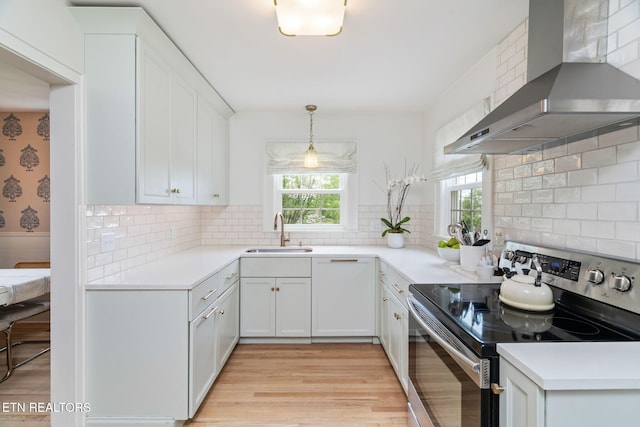 4051 Sutherland Ave, Knoxville, TN 37919 - kitchen featuring electric stove, wall chimney exhaust hood, a sink, light wood-style flooring, and light countertops