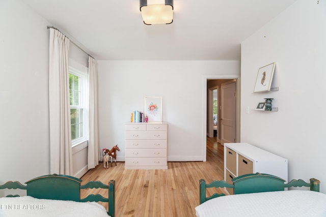 4051 Sutherland Ave, Knoxville, TN 37919 - bedroom with light wood-style floors and baseboards