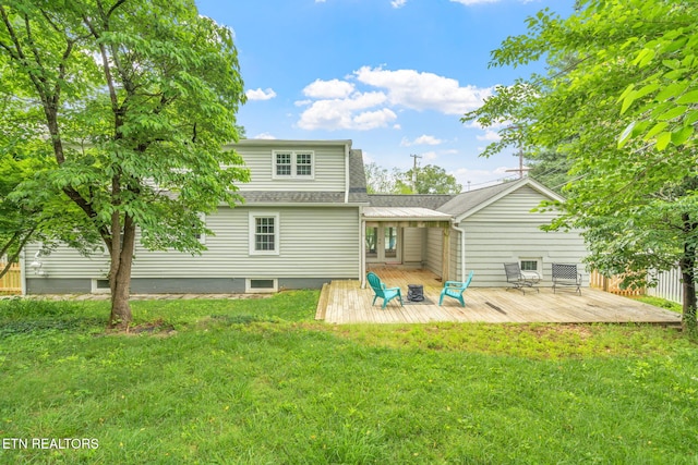 4051 Sutherland Ave, Knoxville, TN 37919 - rear view of property featuring a deck, a lawn, and a shingled roof