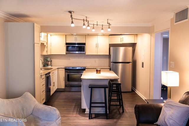 2749 Sullins St Unit B105, Knoxville, TN 37919 - kitchen with stainless steel appliances, crown molding, a sink, tasteful backsplash, and light countertops