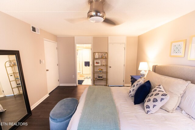 2749 Sullins St Unit B105, Knoxville, TN 37919 - bedroom featuring dark wood-type flooring, ensuite bath, baseboards, and ceiling fan