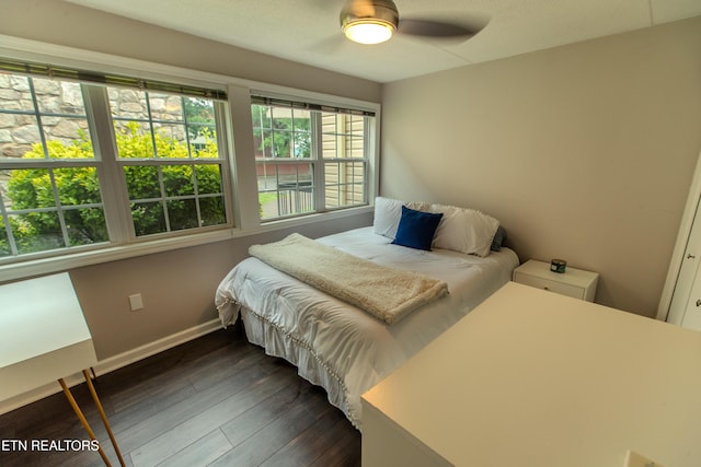 2749 Sullins St Unit B105, Knoxville, TN 37919 - bedroom with dark wood-style flooring and baseboards