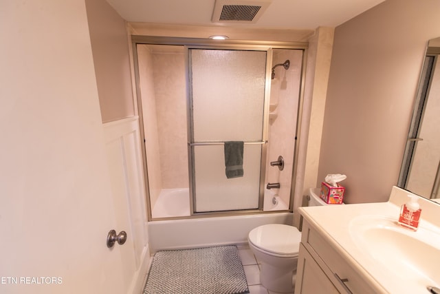 2749 Sullins St Unit B105, Knoxville, TN 37919 - bathroom with vanity, toilet, combined bath / shower with glass door, and tile patterned flooring