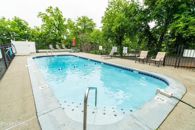 2749 Sullins St Unit B105, Knoxville, TN 37919 - community pool featuring view of wooded area and a patio