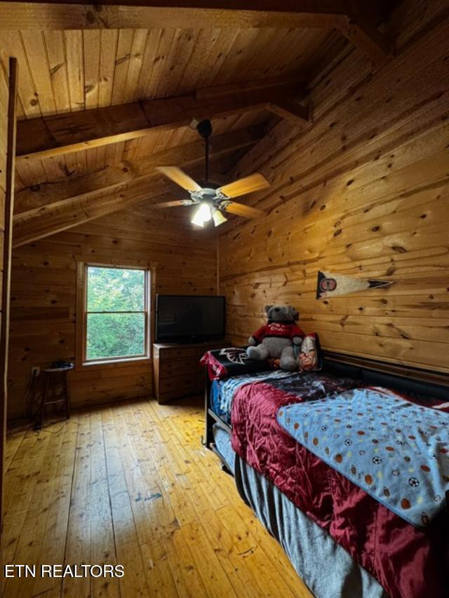 208 Charles Eaves Ln, Benton, TN 37307 - bedroom featuring wood ceiling, wooden walls, and hardwood / wood-style floors