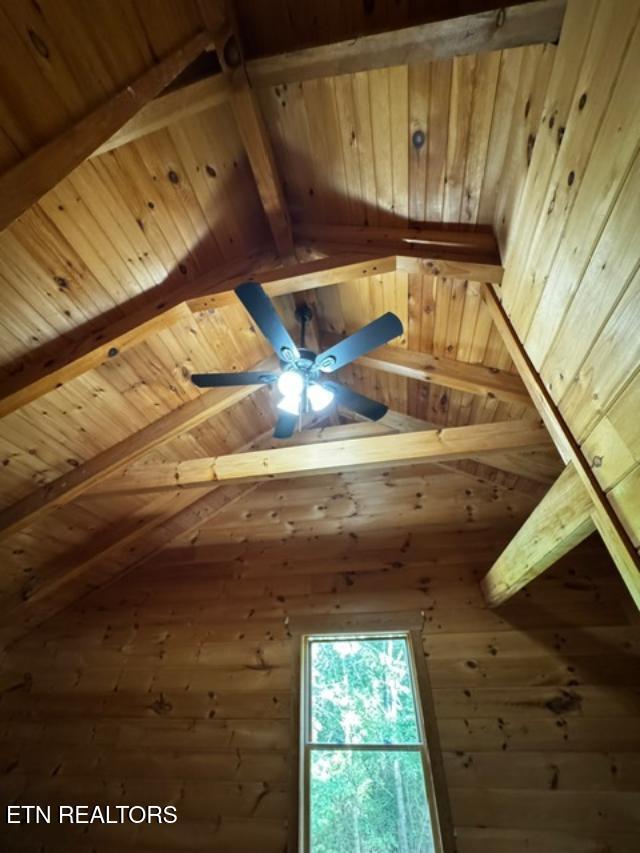 208 Charles Eaves Ln, Benton, TN 37307 - detailed view of wooden ceiling with exposed beams and ceiling fan