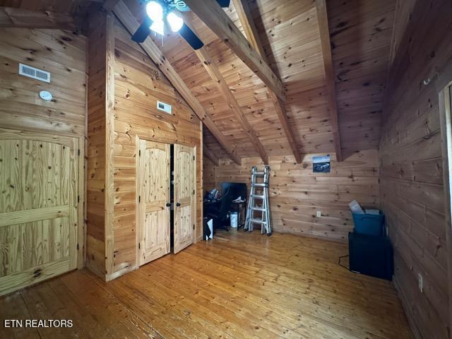 208 Charles Eaves Ln, Benton, TN 37307 - bonus room with wooden walls, hardwood / wood-style flooring, wood ceiling, and a ceiling fan