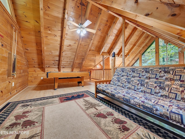 unfurnished living room featuring wooden ceiling, wood walls, a ceiling fan, and wood finished floors