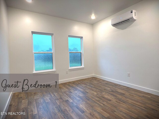1146 Moodyville Loop, Byrdstown, TN 38549 - spare room with a wall mounted AC, dark wood-style flooring, and recessed lighting