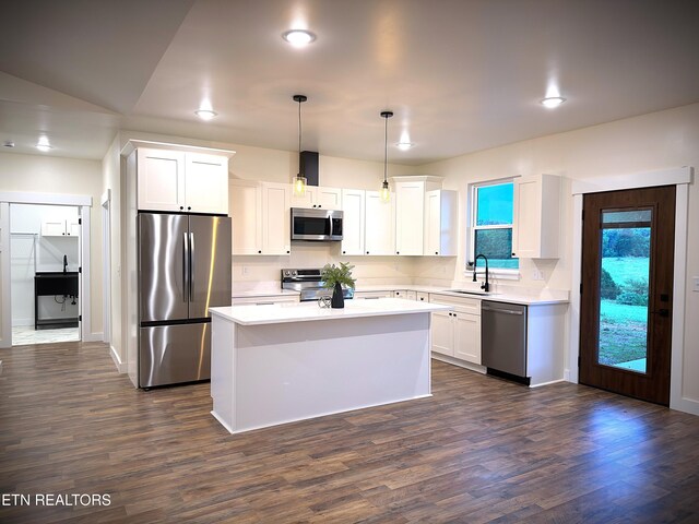 1146 Moodyville Loop, Byrdstown, TN 38549 - kitchen with appliances with stainless steel finishes, white cabinetry, a center island, light countertops, and dark wood-type flooring