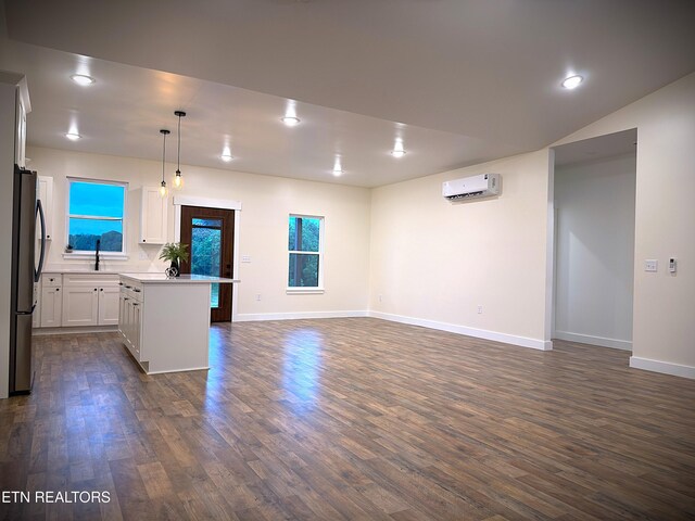 1146 Moodyville Loop, Byrdstown, TN 38549 - kitchen with an AC wall unit, freestanding refrigerator, dark wood-style floors, open floor plan, and recessed lighting