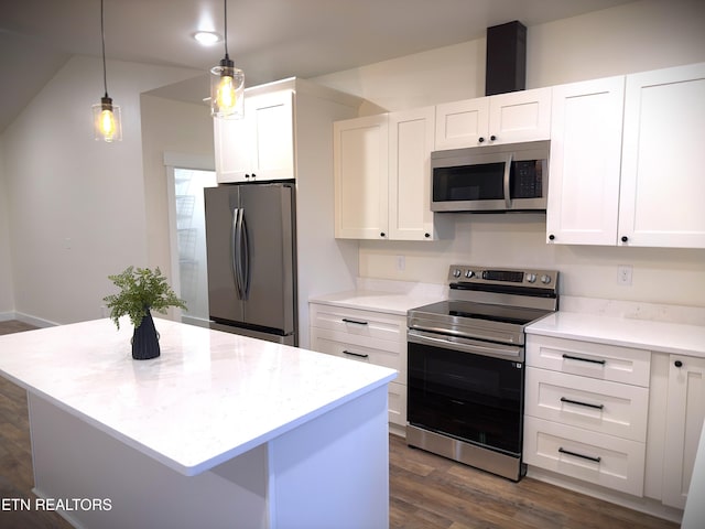 1146 Moodyville Loop, Byrdstown, TN 38549 - kitchen featuring appliances with stainless steel finishes, white cabinetry, dark wood-type flooring, and a center island