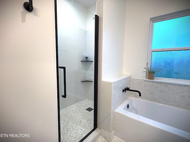 1146 Moodyville Loop, Byrdstown, TN 38549 - bathroom featuring a shower stall and a bath