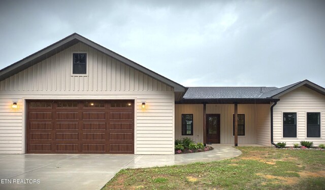 1146 Moodyville Loop, Byrdstown, TN 38549 - view of front of home featuring driveway, board and batten siding, and a shingled roof