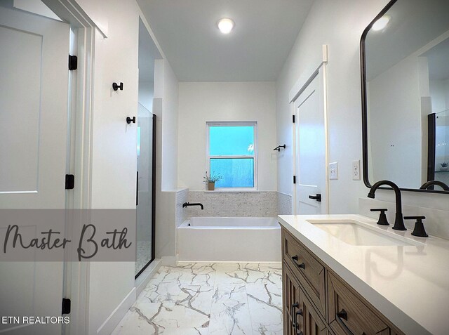 1146 Moodyville Loop, Byrdstown, TN 38549 - bathroom with vanity, a garden tub, a stall shower, and marble look tile flooring