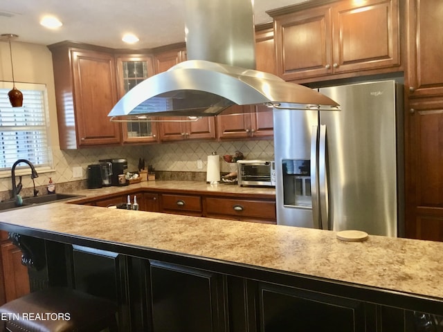 1018 Southwind Cir, Dandridge, TN 37725 - kitchen featuring stainless steel refrigerator with ice dispenser, a sink, island range hood, backsplash, and glass insert cabinets