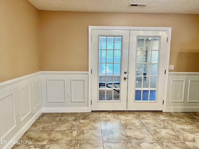 1018 Southwind Cir, Dandridge, TN 37725 - doorway to outside with french doors, a wainscoted wall, and a decorative wall