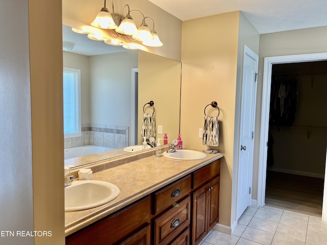 1018 Southwind Cir, Dandridge, TN 37725 - full bath featuring tile patterned flooring, a chandelier, double vanity, and a tub to relax in
