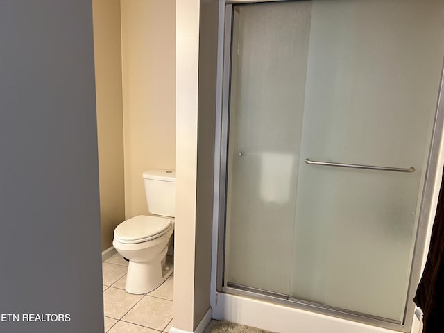 1018 Southwind Cir, Dandridge, TN 37725 - full bathroom with tile patterned floors, a shower stall, toilet, and baseboards