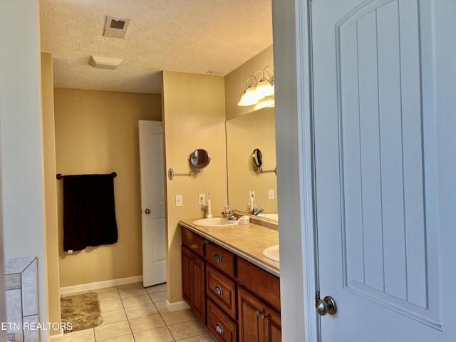 1018 Southwind Cir, Dandridge, TN 37725 - full bathroom with tile patterned flooring, double vanity, a textured ceiling, and baseboards