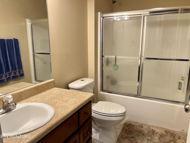 1018 Southwind Cir, Dandridge, TN 37725 - bathroom with tile patterned flooring, shower / bath combination with glass door, vanity, and toilet