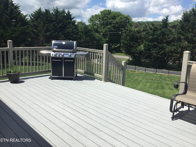 1018 Southwind Cir, Dandridge, TN 37725 - wooden deck featuring area for grilling and a lawn