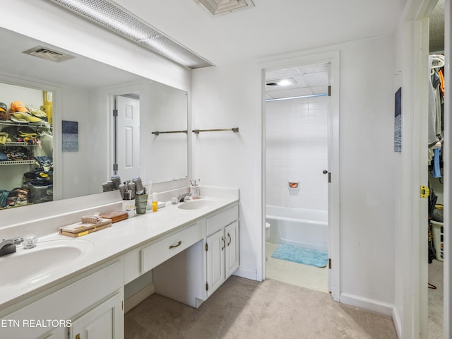 203 Regal Tower, Maryville, TN 37804 - bathroom featuring double vanity, a spacious closet, toilet, baseboards, and shower / tub combination