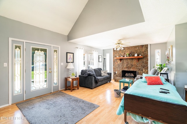 410 Railey Ln, Huntsville, TN 37756 - living area with light wood-style floors, a fireplace, lofted ceiling, ceiling fan, and baseboards