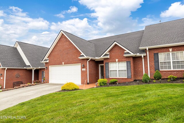 7235 Alysha Vineyard Way, Knoxville, TN 37931 - traditional-style house with a garage, brick siding, a front lawn, and concrete driveway