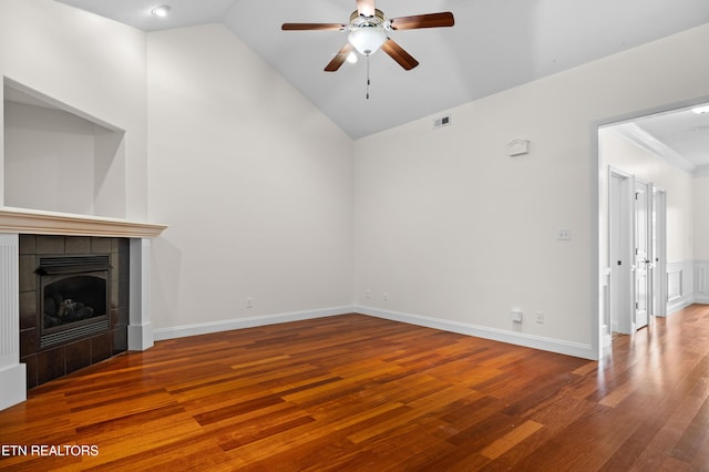 7235 Alysha Vineyard Way, Knoxville, TN 37931 - unfurnished living room with wood finished floors, a ceiling fan, lofted ceiling, and a tiled fireplace