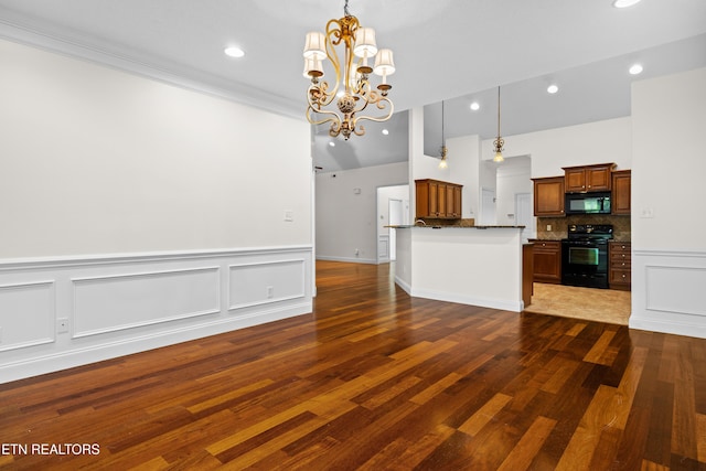 7235 Alysha Vineyard Way, Knoxville, TN 37931 - kitchen featuring black appliances, a chandelier, wood finished floors, decorative backsplash, and decorative light fixtures