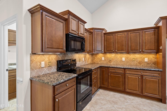 7235 Alysha Vineyard Way, Knoxville, TN 37931 - kitchen featuring black appliances, dark stone counters, backsplash, lofted ceiling, and light tile patterned floors