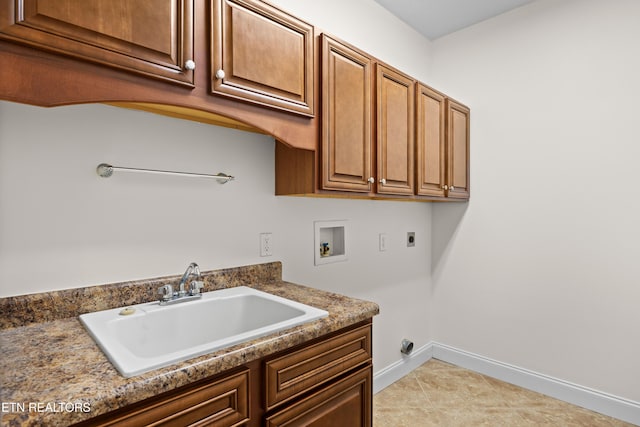 7235 Alysha Vineyard Way, Knoxville, TN 37931 - washroom featuring electric dryer hookup, washer hookup, cabinet space, baseboards, and light tile patterned floors