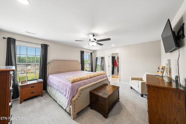 2516 Lemon Berry St, Knoxville, TN 37932 - bedroom with light colored carpet, a spacious closet, ceiling fan, a textured ceiling, and recessed lighting