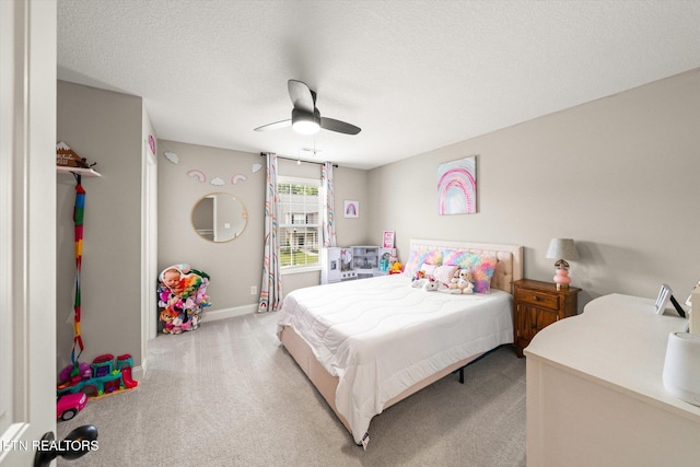 2516 Lemon Berry St, Knoxville, TN 37932 - bedroom with light colored carpet, a ceiling fan, baseboards, and a textured ceiling