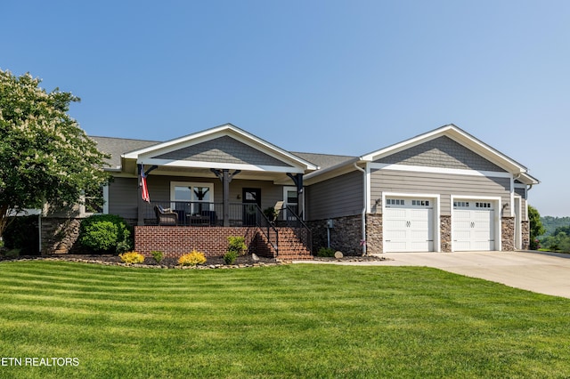 119 Pointe Summit Dr, Greenback, TN 37742 - craftsman-style home featuring a garage, a porch, concrete driveway, a front yard, and stairway