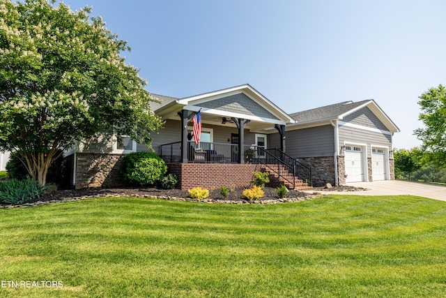 119 Pointe Summit Dr, Greenback, TN 37742 - view of front of property with stairway, covered porch, an attached garage, a front lawn, and driveway