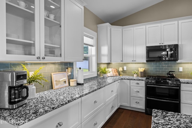 119 Pointe Summit Dr, Greenback, TN 37742 - kitchen featuring range with two ovens, black microwave, vaulted ceiling, white cabinetry, and light stone counters