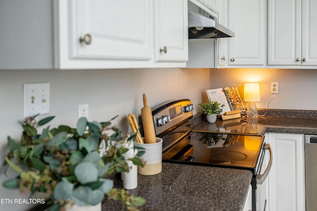 6944 Berry Ln, Knoxville, TN 37914 - kitchen with appliances with stainless steel finishes, under cabinet range hood, white cabinets, and built in study area