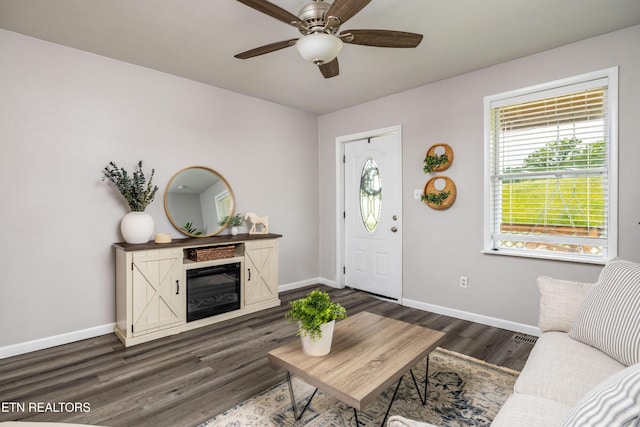 6944 Berry Ln, Knoxville, TN 37914 - entrance foyer featuring baseboards, a glass covered fireplace, dark wood-style flooring, and a ceiling fan
