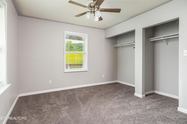 6944 Berry Ln, Knoxville, TN 37914 - unfurnished bedroom featuring carpet flooring, two closets, baseboards, and a ceiling fan