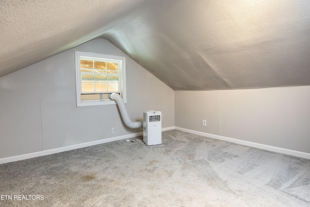 6944 Berry Ln, Knoxville, TN 37914 - additional living space featuring a textured ceiling, carpet, lofted ceiling, and baseboards