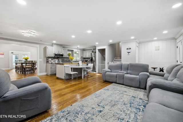 828 Noragate Rd, Knoxville, TN 37919 - living area featuring stairs, recessed lighting, light wood-style floors, crown molding, and baseboards