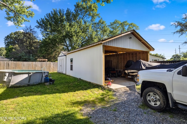 828 Noragate Rd, Knoxville, TN 37919 - view of home's exterior with an outbuilding and a carport